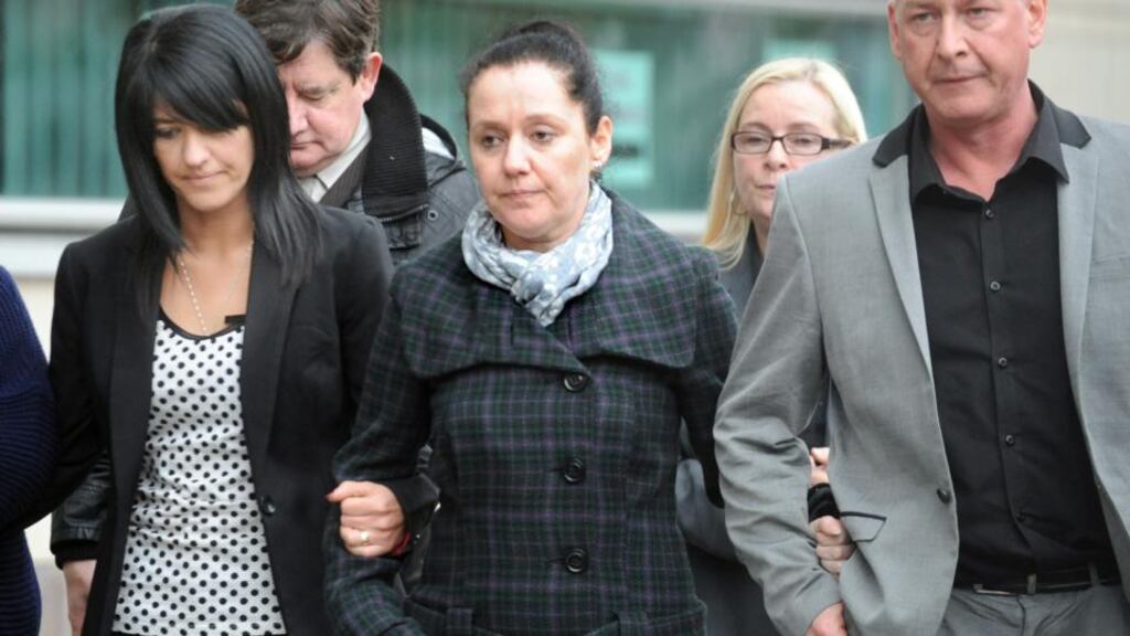 Áine Adams (centre) outside Belfast Crown Court this evening with her sister Seanin after their father’s conviction. Photograph: Photopress