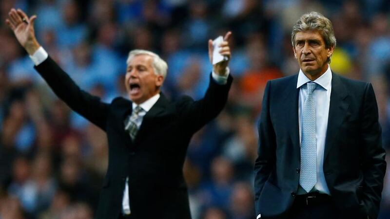 Manchester City’s manager Manuel Pellegrini (right) and his Newcastle United counterpart Alan Pardew at the Etihad Stadium in Manchester. Photograph: Darren Staples/Reuters