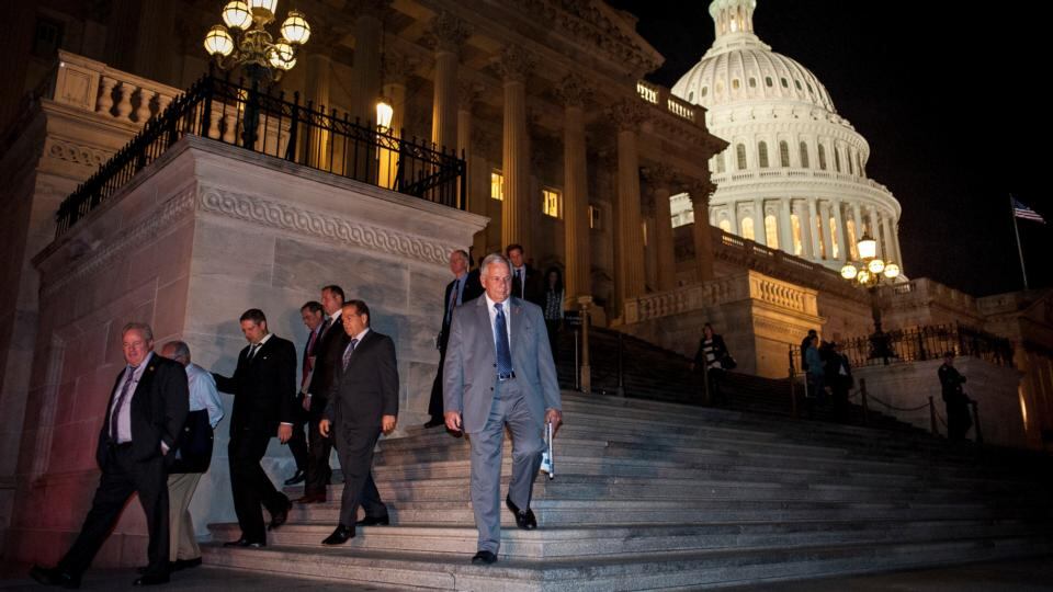 Members of the House of Representatives leave the US Capitol last night. The US Congress voted to halt the 16-day government shutdown and raise the US debt limit, ending the nation’s fiscal impasse. Photograph: Pete Marovich/Bloomberg