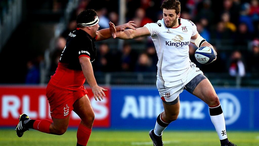 Ulster’s Stuart McCloskey holds off Jamie George of Saracens during the European Champions Cup match at Allianz Park. Photograph: Jordan Mansfield/Getty Images