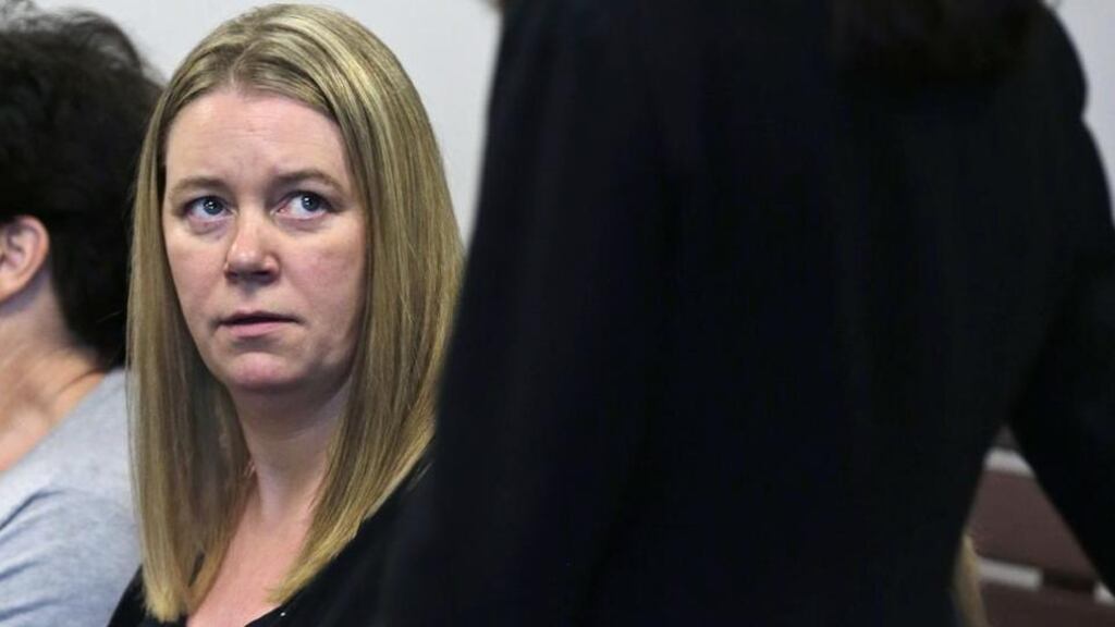 Irish nanny Aisling Brady McCarthy listens to her lawyer prior to a status hearing at Middlesex Superior Court in Woburn, Massachusetts. Ms McCarthy is accused of killing a child in her care in 2013. Photograph: AP Photo/Charles Krupa, Pool