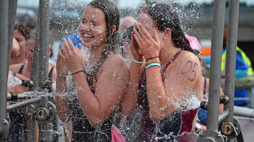 Danika Sugrue (left) and Rachel Nevins  after the 94th Dublin City Liffey Swim supported by Dublin City Council and staged by The Open Sea Committee at the weekend. Photograph: Dara Mac Dónaill / The Irish Times