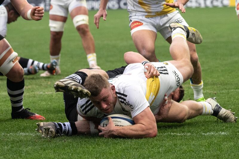 La Rochelle's French hooker Pierre Bourgarit dives across the line to score a try during the European Rugby Champions Cup match between La Rochelle and Leicester Tigers. Photograph: Xavier Leoty/AFP via Getty Images