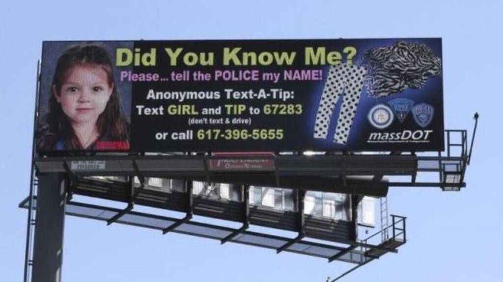 A billboard in the US showing the image of the toddler found on a Boston Harbor beach.