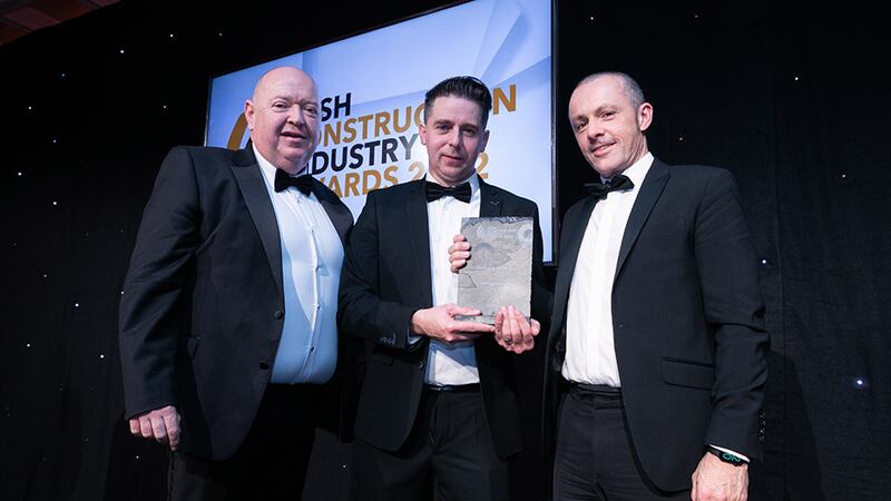 David Waldron, managing director, Tier3Tech, presents the Consultancy of the Year award to James Redmond and Barry Flynn, IN2 Engineering.