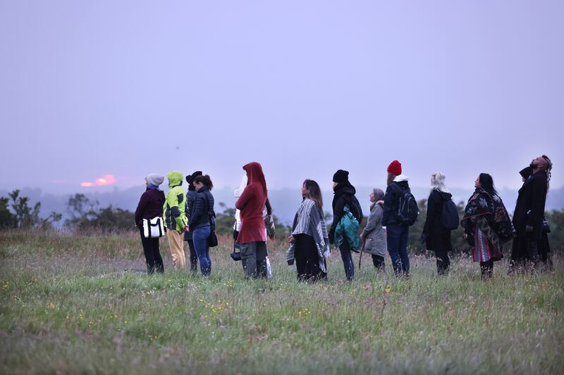 People gather for sunrise to celebrate the summer solstice at the Hill of Tara, Co Meath. Photograph: Dara Mac Dónaill