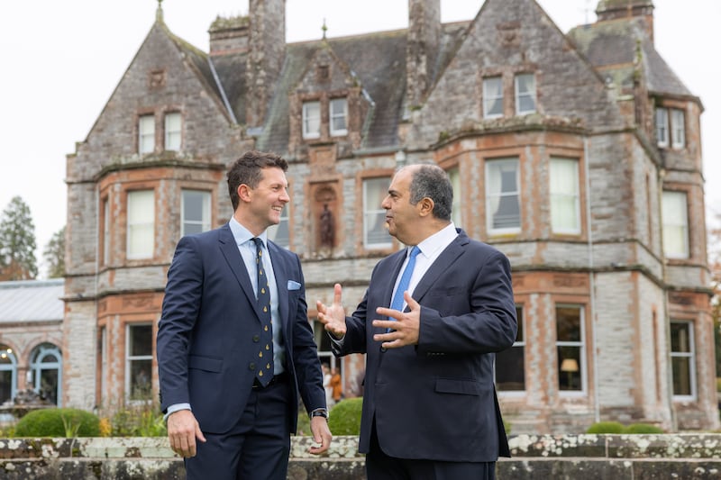 Pictured at the inaugural North-South Business Cooperation Awards at Castle Leslie in Co Monaghan were Sam Shephard, left, gold award winner and founder of Juice Jar who received a cheque for €150,000 from awards scheme founder Stelios Haji-Ioannou. Photograph:Naoise Culhane