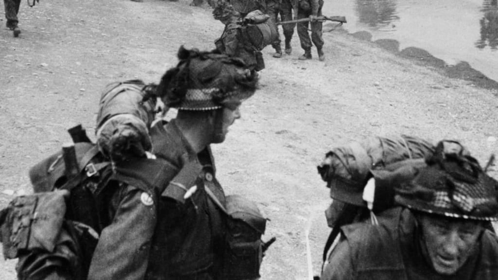 Troops pour ashore at one of the Normandy beaches during the D Day invasion. Photograph: Popperfoto/Getty
