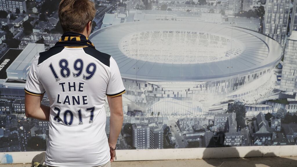 A Spurs fan looks at an artist’s impression of the new stadium