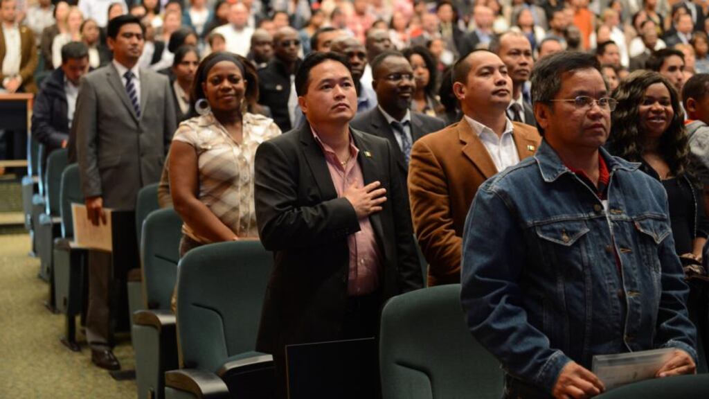 Processes and processions: a citizenship ceremony in Dublin, at which 4,000 immigrants became Irish citizens. Photograph: Frank Miller