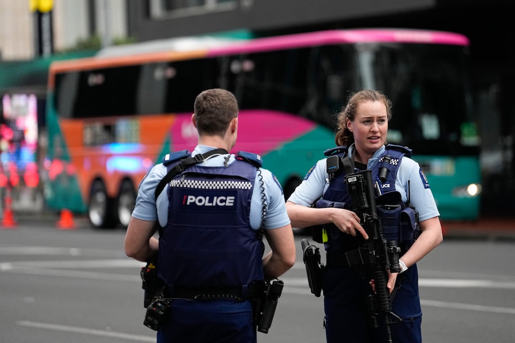Armed police officers stand outside a Women’s World Cup team hotel in central Auckland following the shooting. Photograph: Abbie Parr/AP/PA