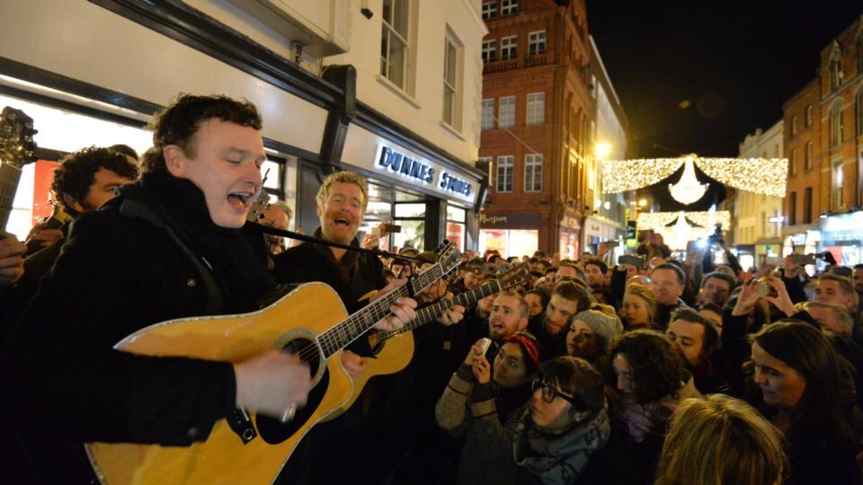 Mundy and Glen Hansard entertain the crowd on Grafton Street. Photograph: Alan Betson / The Irish Times
