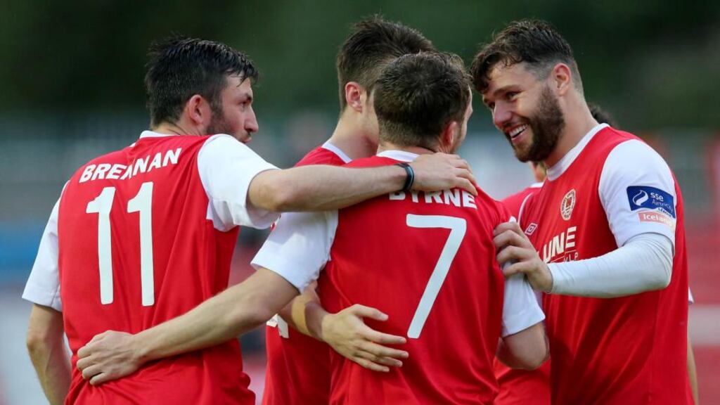 St. Pats’ Conan Byrne celebrates scoring a penalty for their second goal of the game with Killian Brennan and James Chambers. Photograph: Ryan Byrne/Inpho