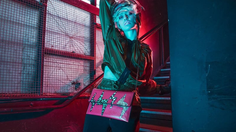 Luxe tracksuit jacket (€240), tracksuit pants (€185), black mittens (€115) Olori Boutique, Cork. Bedrock clutch ($208) Kent Stetson Designs, USA. Metallic heels (€127) Shooz Footwear & Accessories, Mallow Cork. Vintage Perspex Visor helmet (€120) The Village Hall, Cork.