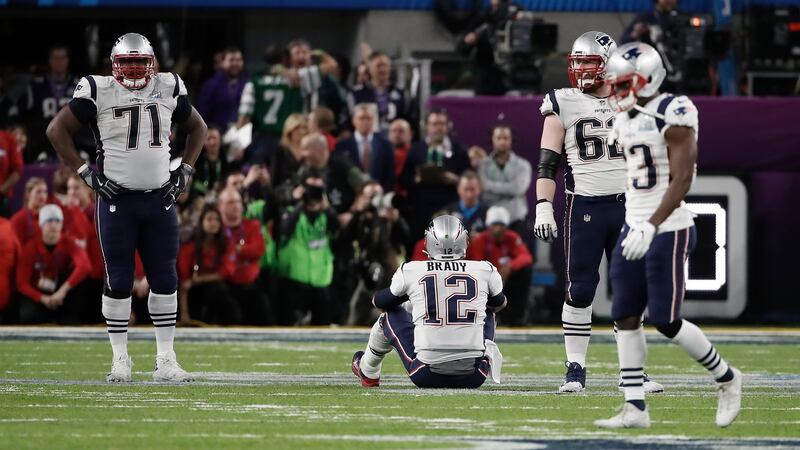 New England Patriots quarterback Tom Brady, offesnive tackle Cameron Fleming and offensive guard Joe Thuney dejected after the end of the game. Photo: Tannen Maury/EPA