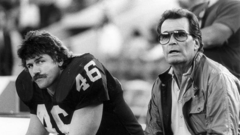 Los Angeles Raiders tight end Todd Christensen and actor James Garner on the bench during game against Cleveland Browns at Los Angeles Memorial Coliseumin Los Angeles. Photograph: Vic Milton/Getty Images