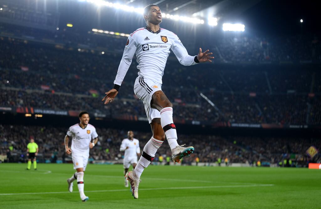 Marcus Rashford of Manchester United celebrates an own goal by Jules Kounde of Barcelona during the Europa League knock-out round playoff first leg at the Camp Nou. Photograph: David Ramos/Getty Images