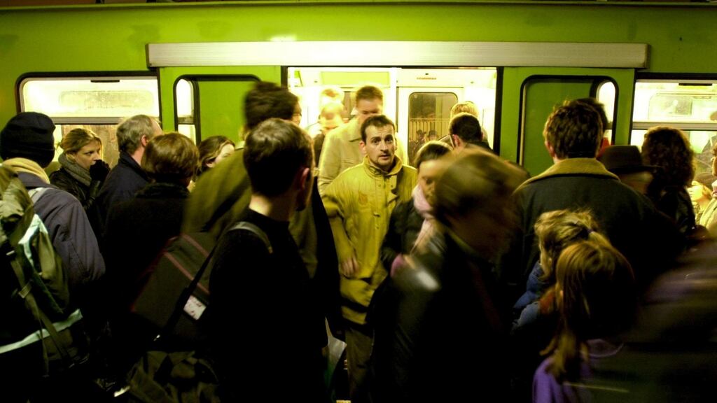 The doors open, and a sea of bodies almost spills out onto the platform. Photograph:  Frank Miller