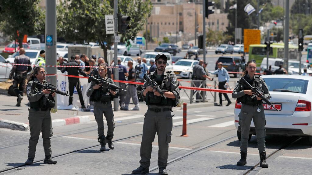 Israeli security forces cordon off the site of a reported attack near the Sheikh Jarrah neighbourhood in Israeli-annexed east Jerusalem. Photograph: Ahmad Gharabli/AFP via Getty