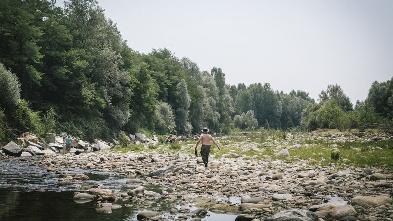 Pierre Guide, a French goldpanner, walks along the Elvo River near Cerrione, Italy. Photograph: Gianni Cipriano/The New York Times