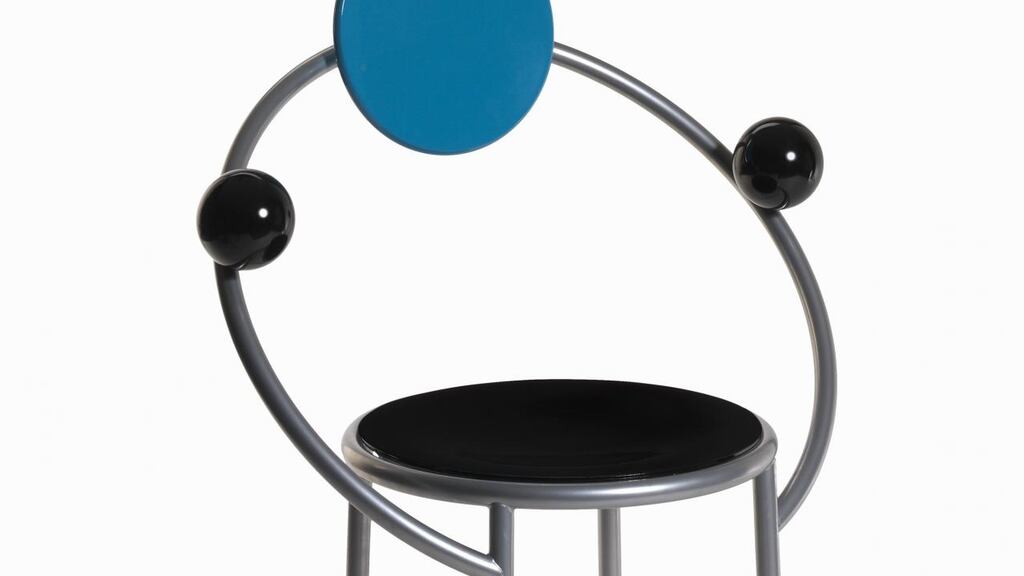 Memphis First Chair, 1983: The base and back are enamelled wood while the curved frame is metal.