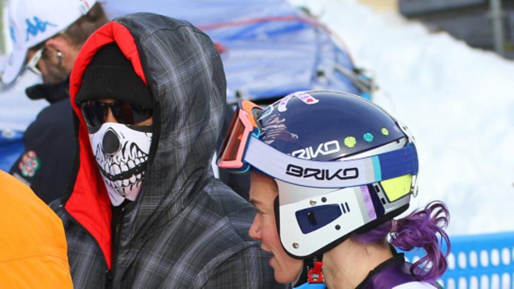 Tiger Woods (L) had a tooth knocked out while watching girlfriend Lindsey Vonn win a record 63rd World Cup title. (Photo by Mitchell Gunn/Getty Images)