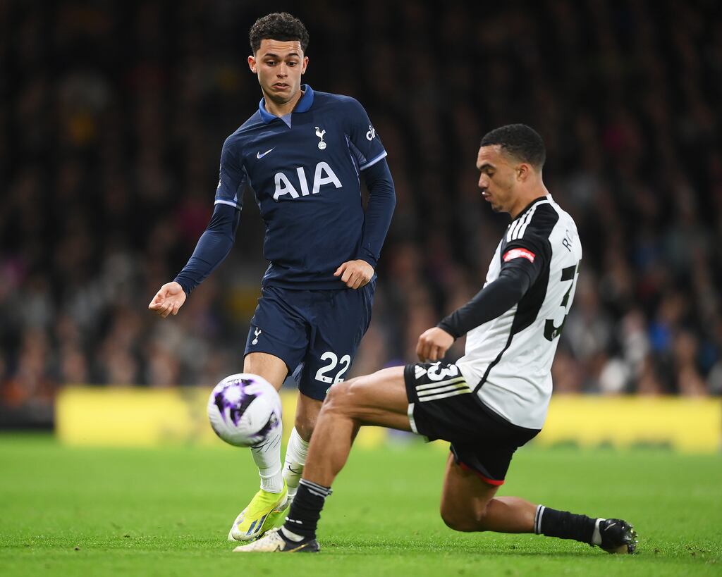 Brennan Johnson of Tottenham Hotspur is challenged by Antonee Robinson of Fulham. Photograph: Alex Davidson/Getty