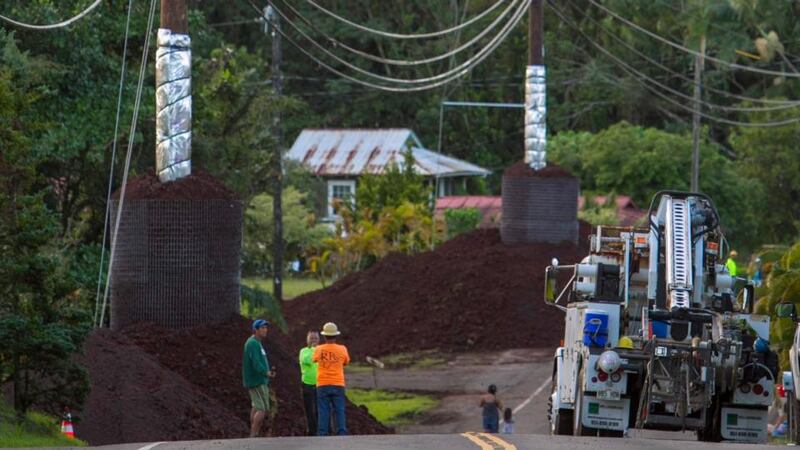 Construction crews prepare Pahoa village Road ahead of the arrival of a lava flow from Mount Kilauea. Photograph: Reuters