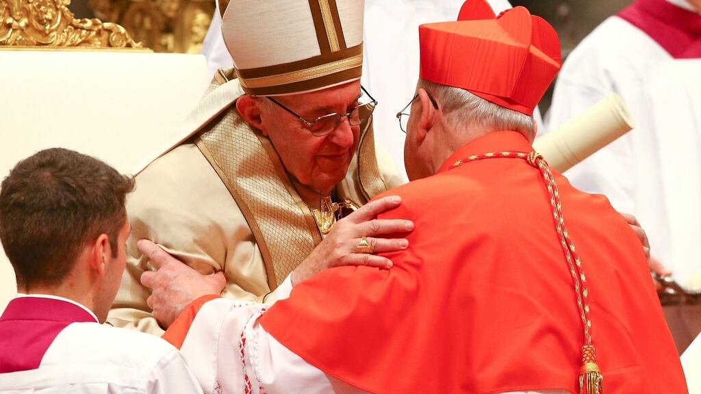 Pope Francis embraces new cardinal Kevin Joseph Farrell of the US during a Consistory ceremony to install 17 new cardinals in Saint Peter’s Basilica at the Vatican on Saturday. Photograph: Reuters