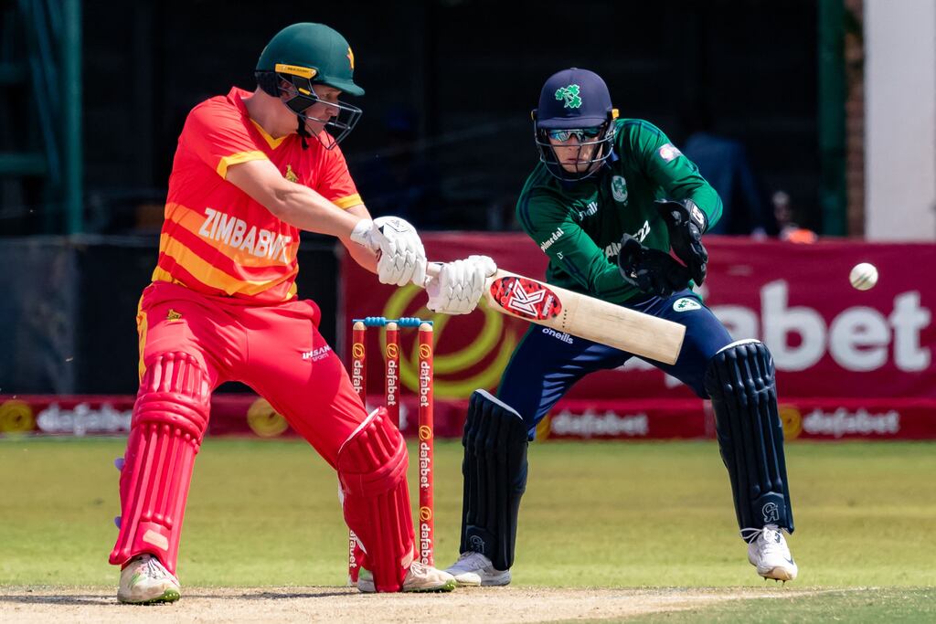 Zimbabwe's Gary Ballance plays a shot while Ireland's Lorcan Tucker attempts to catch the ball during a one day international cricket match between the countries in Harare in January. Photograph: Jekesai Njikizana/AFP via Getty Images
