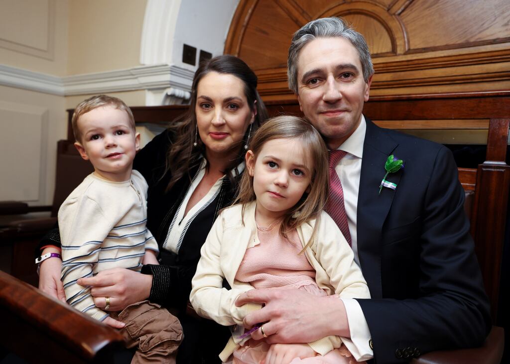 Gardaí are investigating threats made to the Taoiseach and his family on social media at the weekend. Simon Harris, his wife Caoimhe and children Cillian and Saoirse are pictured in the Dáil Chamber, Leinster House. Photograph: Maxwells