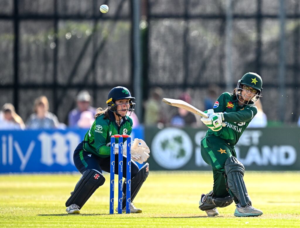 Pakistan batter Muneeba Ali plays a shot, watched by Ireland wicketkeeper Amy Hunter, on her way to an unbeaten century in the third T20 international at Castle Avenue in Clontarf. Photograph: Seb Daly/Sportsfile