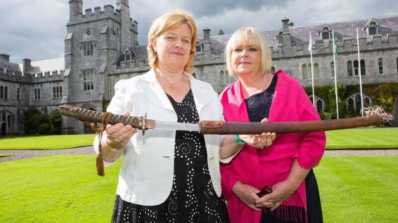 Daughters of the late Dr Aidan MacCarthy from Castletownbere, Co Cork. Nicola and Adrienne MacCarthy, with the sword presented to Dr Aidan by Japanese 2nd Lieutenant Isao Kusuno at the premier of ‘A Doctors Sword’ in UCC. Photograph: Darragh Kane