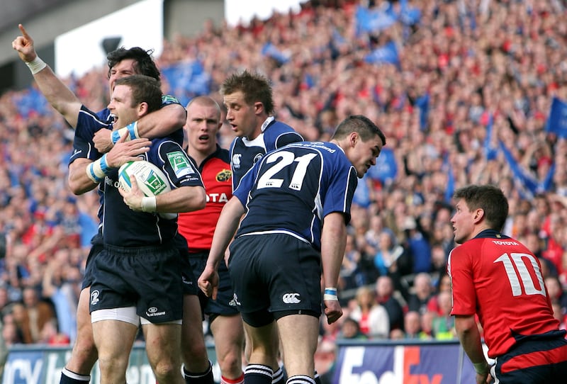 Leinster's Gordon D'Arcy celebrates his try while Jonathan Sexton and Munster's Ronan O'Gara exchange words in May 2009. Photograph: James Crombie/Inpho