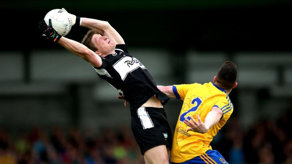 David Kelly, seen here getting the better of Roscommon’s Seán McDermott, was part of a two-man full-forward line for Sligo on Sunday. Photograph: James Crombie/Inpho