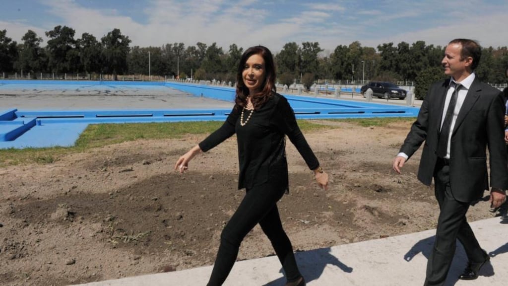 Argentine president Cristina Fernandez (L) walks ahead of Lower House candidate Martin Insaurralde in Buenos Aires. Fernandez has been told by doctors to take a month off for health reasons. Photograph: Argentine Presidency/Reuters.