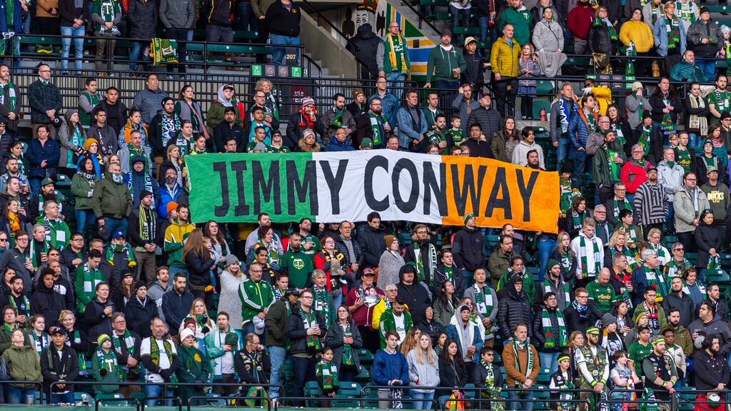 Portland Timbers  supporters unveil a flag in tribute  to their former player Jimmy Conway ahead of the game against  the Vancouver Whitecaps at Providence Park in Portland last Saturday. Photograph: Diego Diaz/Icon Sportswire via Getty Images