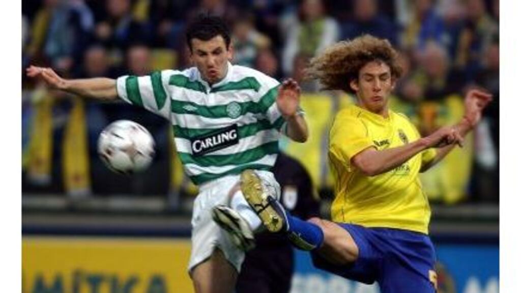 Liam Miller fights for the ball with Villarreal's Fabricio Coloccini during the UEFA Cup quarter-final last night