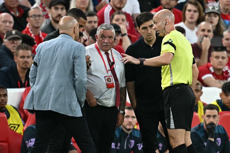 Match referee Anthony Taylor speaks with Liverpool manager Arne Slot and Bournemouth manager Andoni Iraola after Antoine Semenyo reported the incident. Photograph: Paul Ellis/AFP via Getty Images