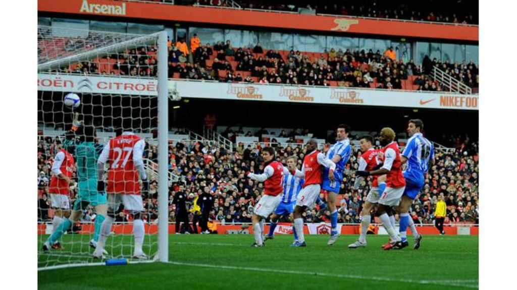 Alan Lee of Huddersfield #19 (C) heads the goal that levels the scores at 1-1 past goalkeeper Manuel Almunia of Arsenal during the FA Cup sponsored by E.ON fourth round match at The Emirates Stadium. - (Photograph: Clive Mason/Getty Images)