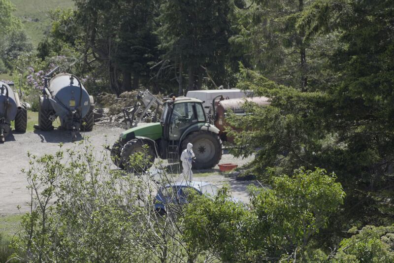 A member of Garda Technical Unit at the scene in Carrig East, Kenmare, on Saturday as they investigate the disappearance of Co Kerry farmer Michael Gaine. Photograph: Noel Sweeney/PA Wire