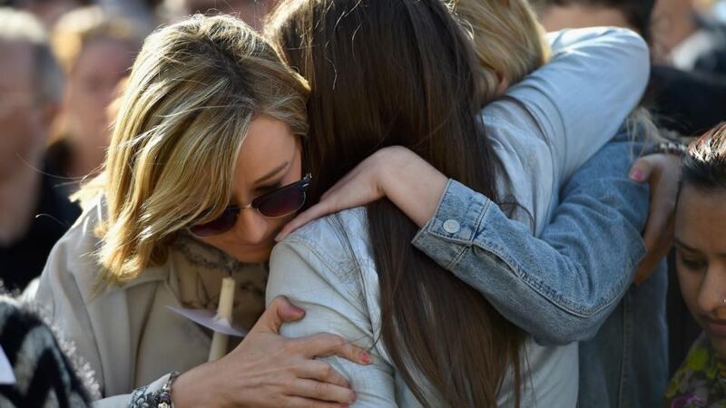 People embrace in George Square, Glasgow during a silent vigil for Karen Buckley. Photograph: Jeff J Mitchell/Getty Images.