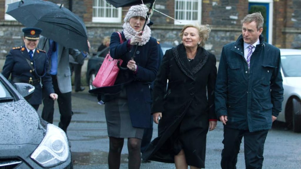 Garda Commissioner Noirín O’Sullivan, Fiona O’Sullivan of the Department of Justice (with umbrella), Minister for Justice and Equality Frances Fitzgerald and Taoiseach Enda Kenny at Garda Headquarters in the Phoenix Park. Photograph: Sam Boal/Photocall Ireland