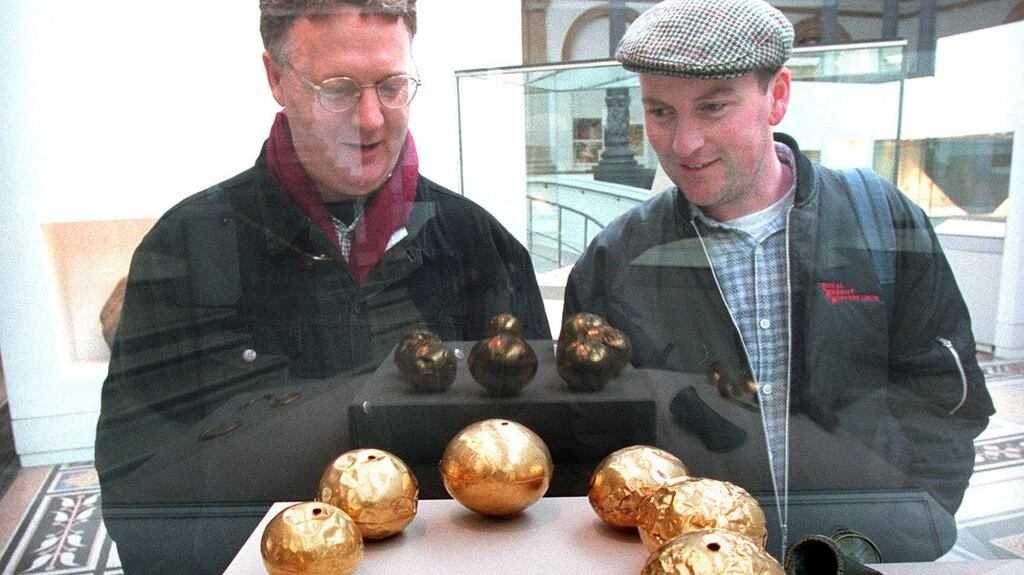 Mathew Nugent (left) from Cabra, Dublin, and Martin Currey from Perth, Western Australia, viewing gold necklace beads at the National Museum, Kildare Street, Dublin. Photograph: Paddy Whelan