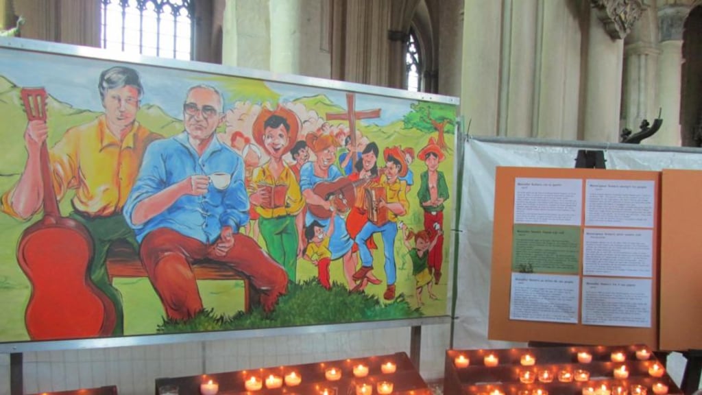 Candle-lit memorial shrine to Bishop Oscar Romero, murdered in El Salvador in 1998, in the Church of Notre Dame in Bruges. Photograph: Peter Murtagh