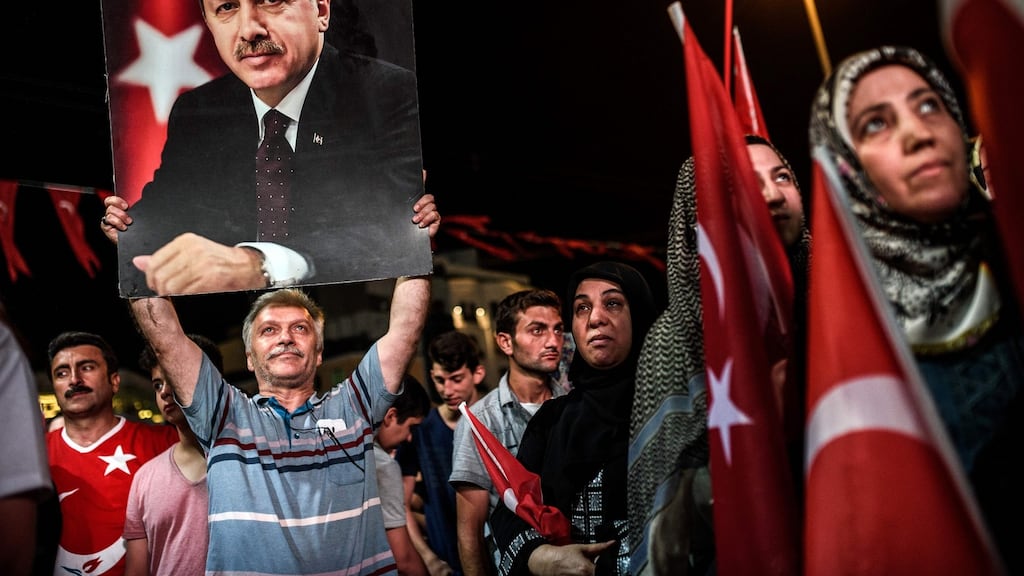 A man holds up a photo of Turkey’s President Recep Tayyip Erdogan during a Pro-Erdogan rally in Taksim square in Istanbul on Friday. Photograph: AFP/Getty Images