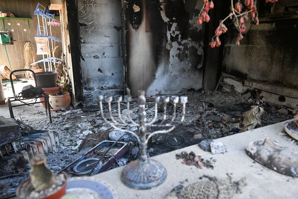 A Hanukkah menorah is left on a countertop in a destroyed house in Kissufim, Israel, after the Hamas atrocity of October 7th, 2024, near the border with Gaza. Photograph: Alexi J Rosenfeld/Getty
