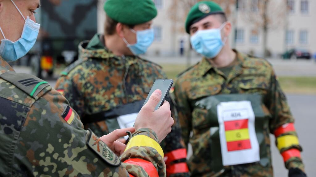 German soldiers testing the use of a tracking app aiming to fight the spread of coronavirus. If put into use the app would track and record people’s interactions via Bluetooth for two weeks. Photograph: Ismael Akbar/Bundeswehr/AFP via Getty Images