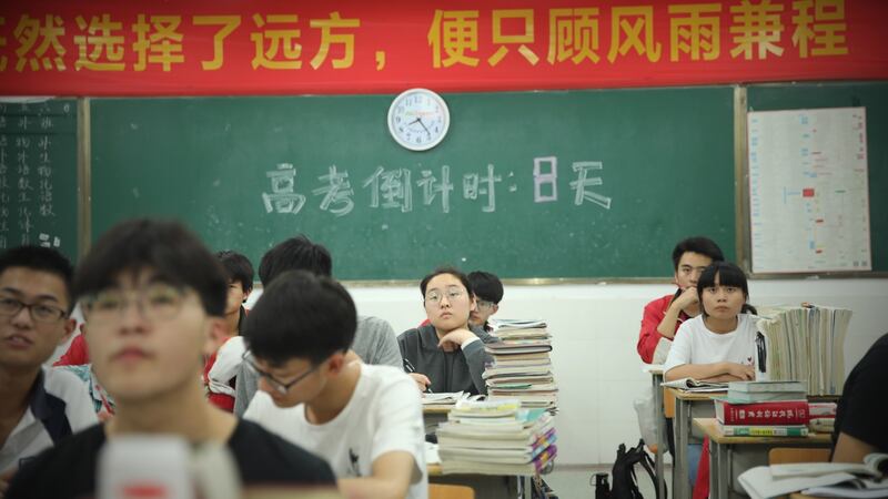 Students study in a classroom at night for the National College Entrance Examination in Fuyang, China: There are more than half a million schools across the country, with 265 million students in the largest public education sector in the world. Photographs: VCG/VCG/Getty