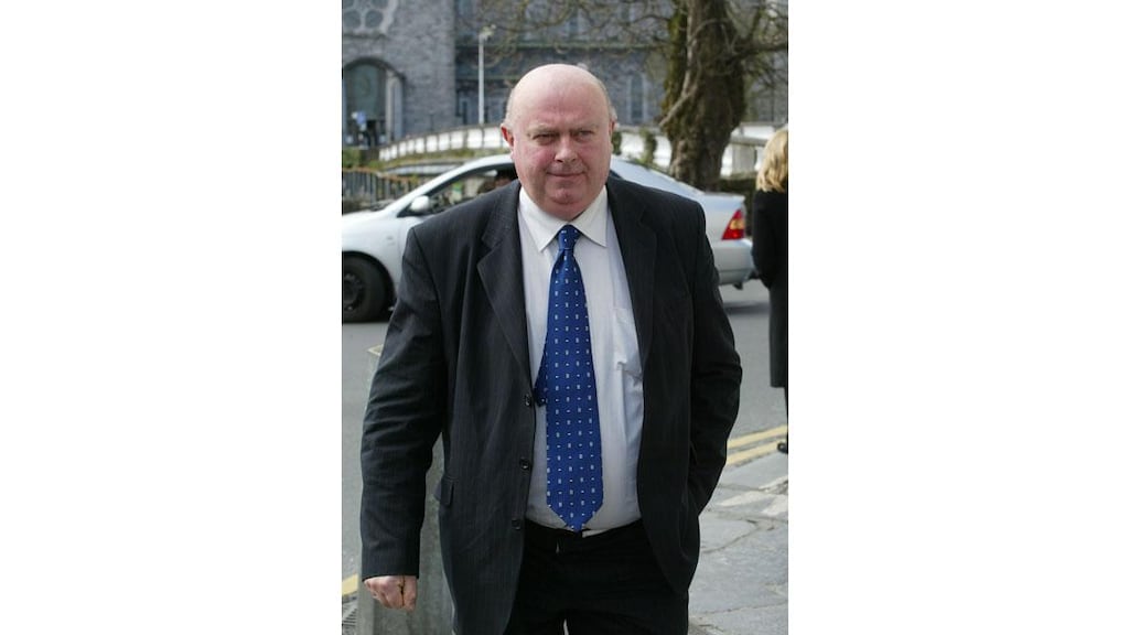 Independent and former Fianna Fail councillor Michael Fahy
leaving Galway District Court yesterday after he was fined and
sentenced for fraud.